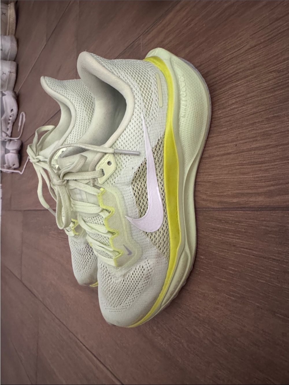 Nike Women's Light Yellow Running Shoes with White Swoosh